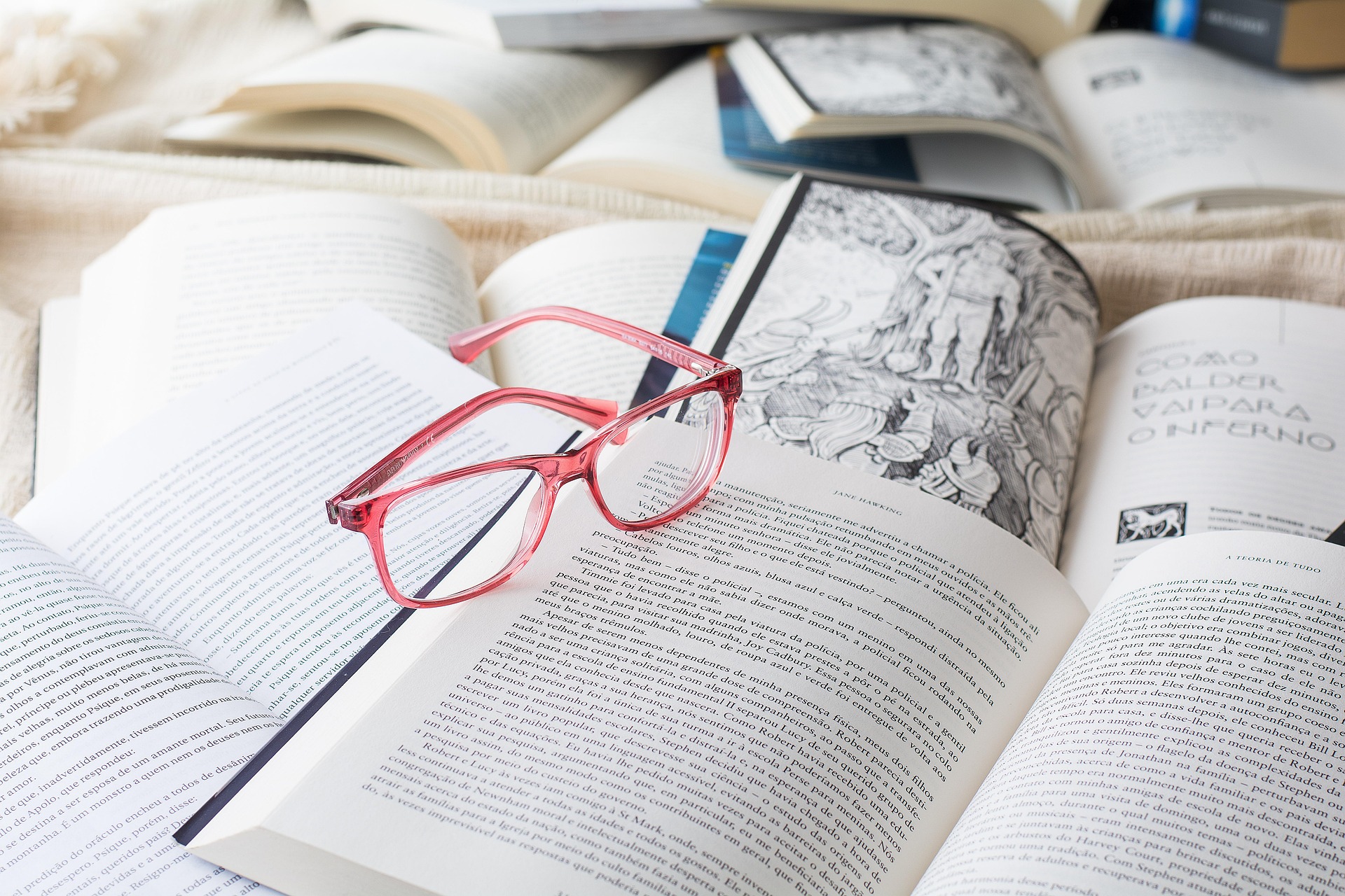 Old books, a quill and a pocket watch
