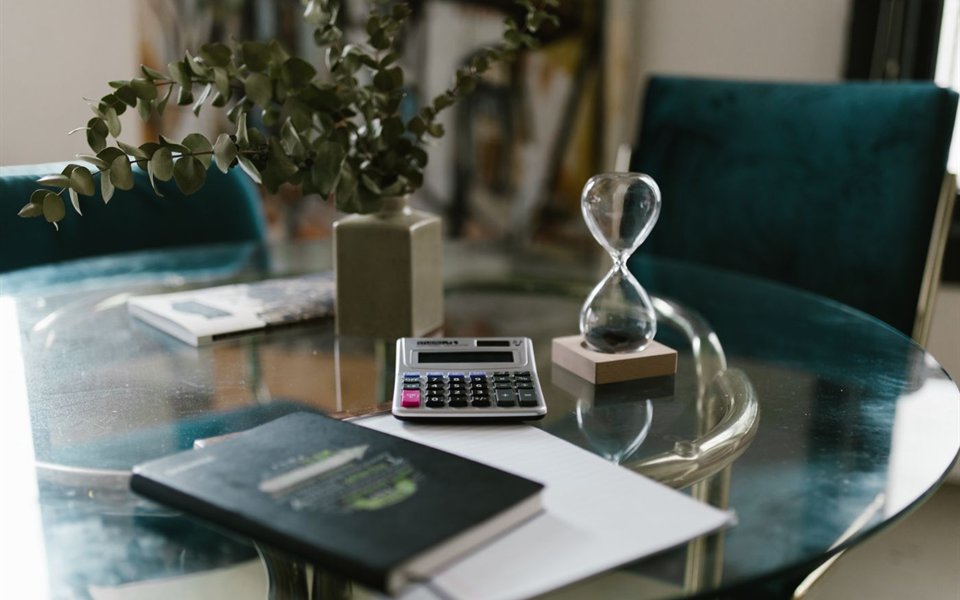 An hourglass on a desk